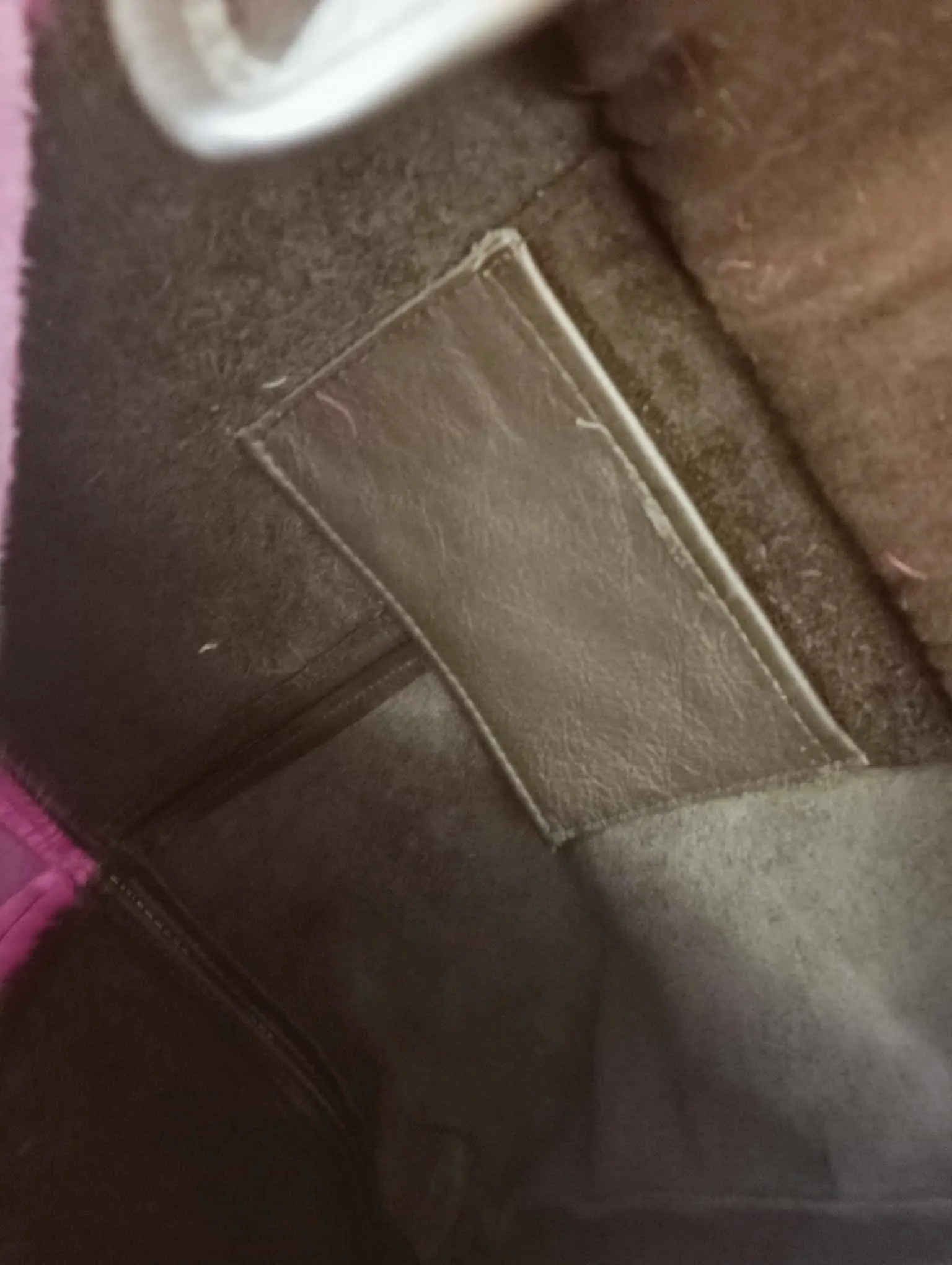 Pink Hair on Black Leather Keepers Bag